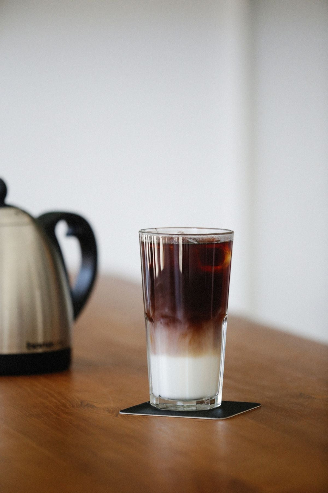 A warm cup of spiced milk in a glass