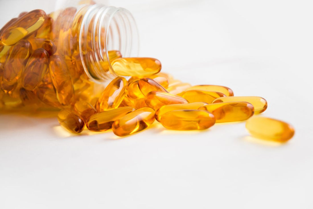 Capsule supplements spilling from a bottle