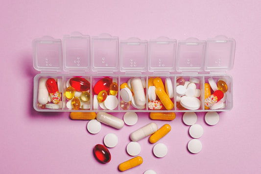 Dietary supplement capsules on a surface