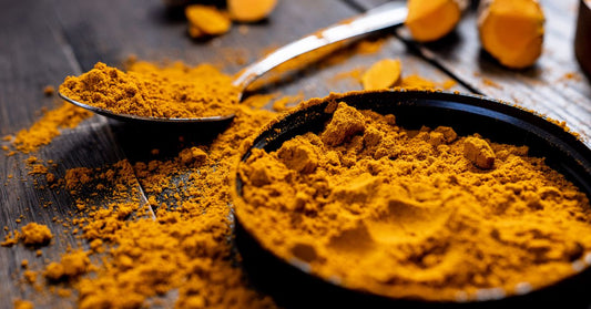 Turmeric powder and root, often paired with ginger