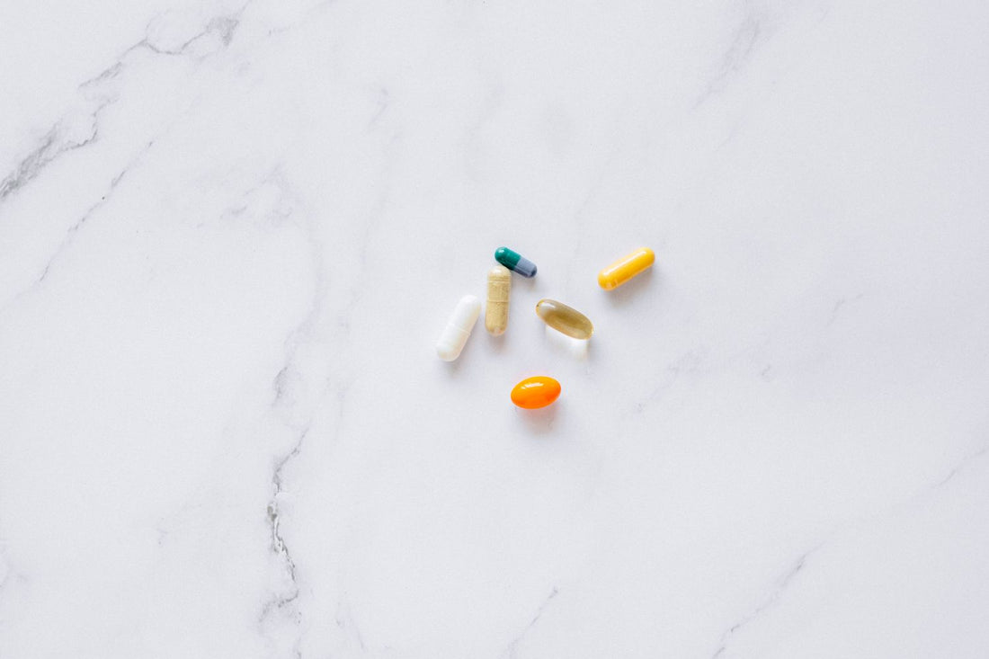 Dietary supplement capsules on a surface