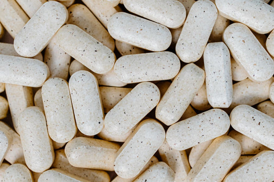 Magnesium supplement capsules on a surface