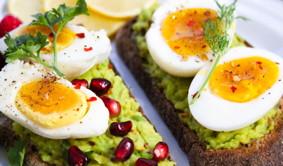A breakfast plate of eggs and avocado on toast