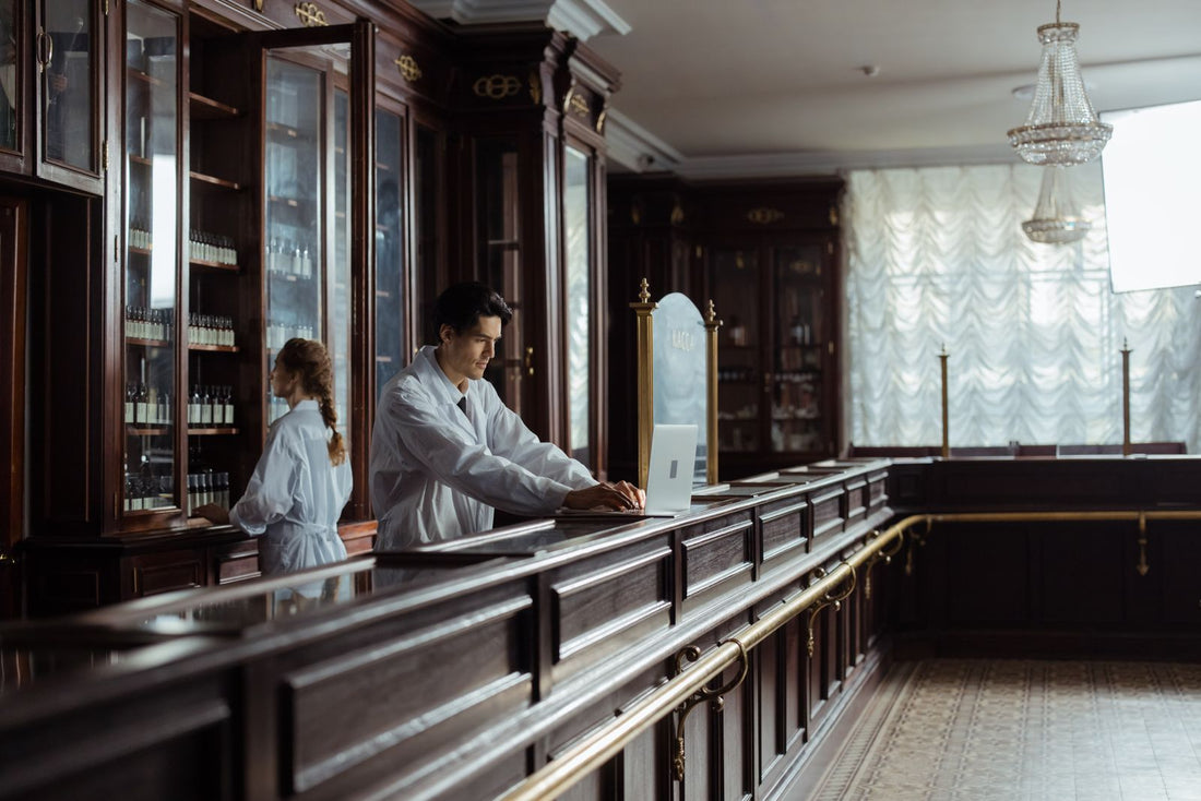 Interior of a pharmacy with rows of wooden medicine drawers